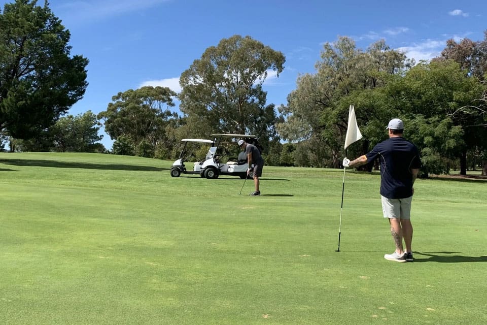 Parkes Golf Course Playing Duo on Putting Green